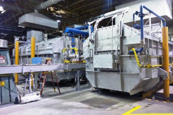 Melting and continuous casting section in an aluminium slug plant