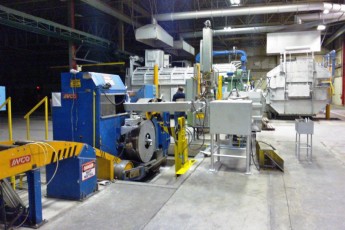 Melting and continuous casting section in an aluminium slug plant
