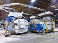 Melting and continuous casting section in an aluminium slug plant