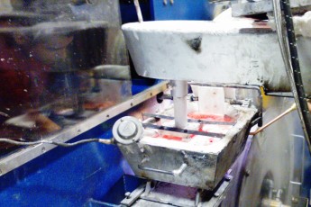 Melting and continuous casting section in an aluminium slug plant
